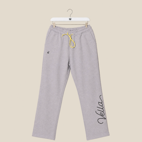 Gray sweatpants with yellow drawstring on a beige background